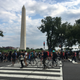 Marchers pass the Washington Monument.